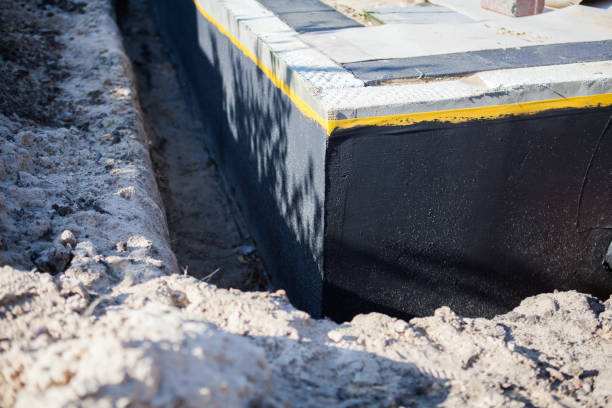 Professional Waterproofing technician working in Smithville, TN